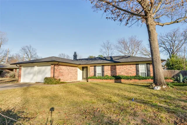 a view of a house with a big yard