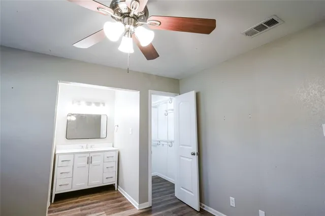 a view of a room with cabinet and cabinet mirror