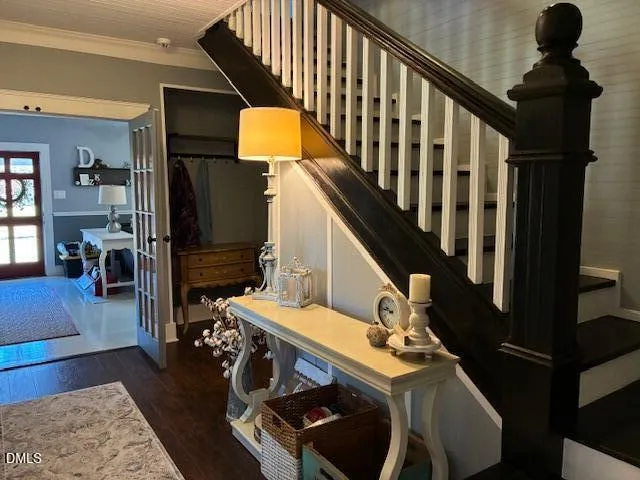 a front view of a house with fountain table and chairs