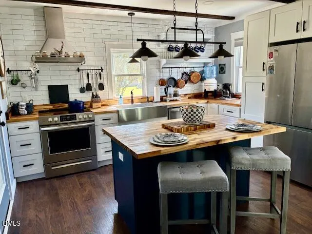 a dining room with furniture and chandelier