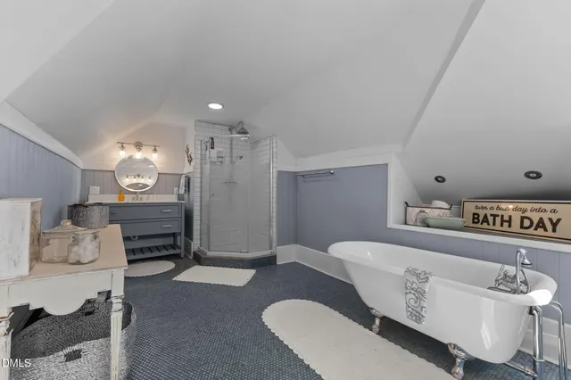 a front view of a house with garden and porch