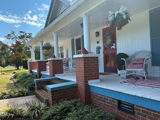a picture of a bench in front of a window