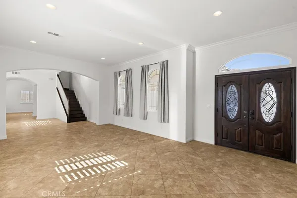 a view of a livingroom with furniture and stairs