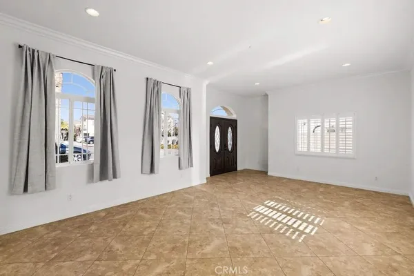 a view of a big room with windows and cabinet