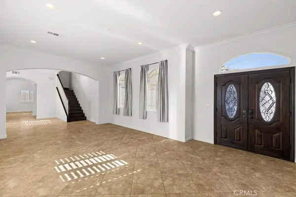 a view of a livingroom with furniture and a window