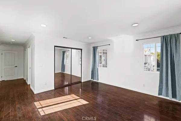a view of livingroom with hardwood floor and hallway