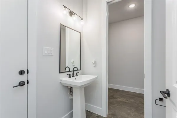 a bathroom with a sink and mirror
