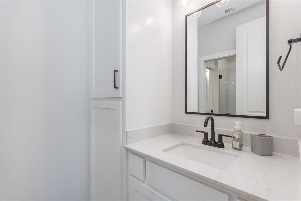 1810 Jc Maples Road Gunter, TX 75058 - Photo 15 of 27 a bathroom with a sink and a mirror