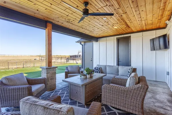 a outdoor space with patio furniture and ocean view