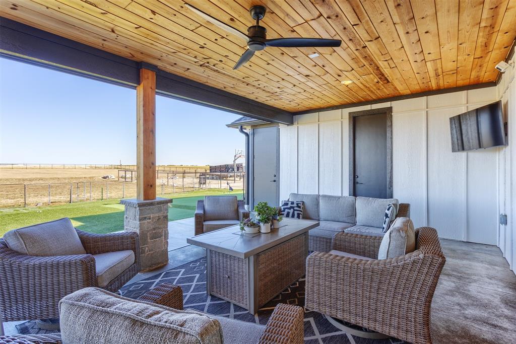 1810 Jc Maples Road Gunter, TX 75058 - Photo 20 of 27 a outdoor space with patio furniture and ocean view