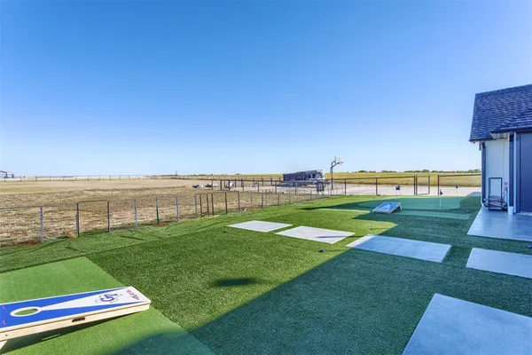 a view of a golf course with a lake view