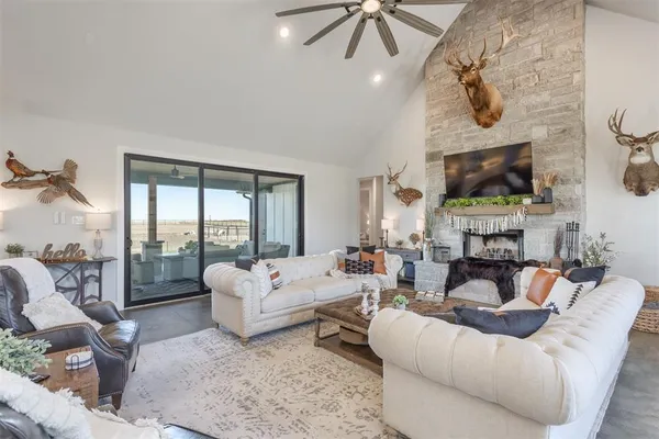 a living room with fireplace furniture and a flat screen tv