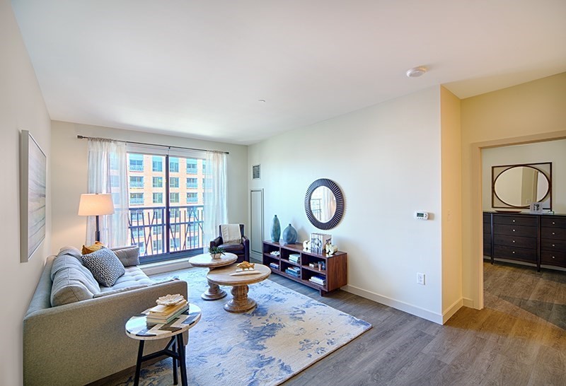 1 Canal Street, Unit 435 Boston, MA 02114 - Photo 1 of 11 a living room with furniture a rug a window and a lamp