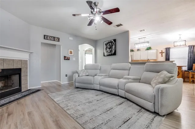 a living room with furniture and a fireplace