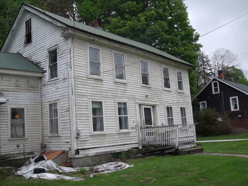 35 Goshen Road Williamsburg, MA 01096 - Photo 2 of 21 a front view of a house with a yard