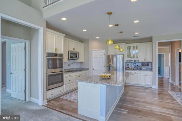 a bedroom with furniture and a flat screen tv