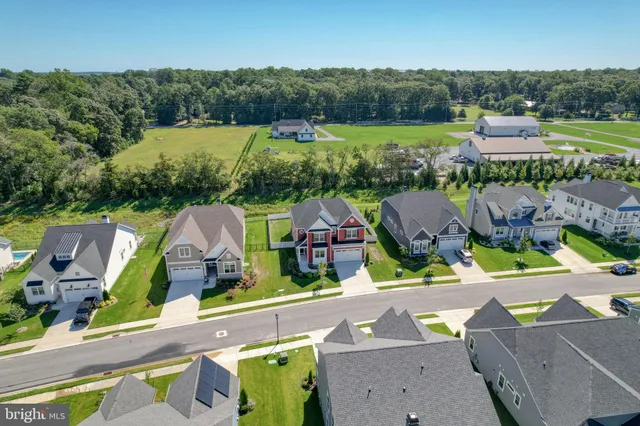 a front view of a house with outdoor seating