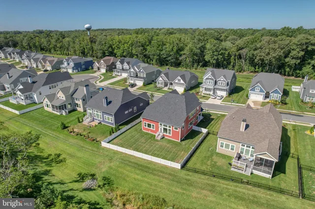 a front view of a house with a yard and porch