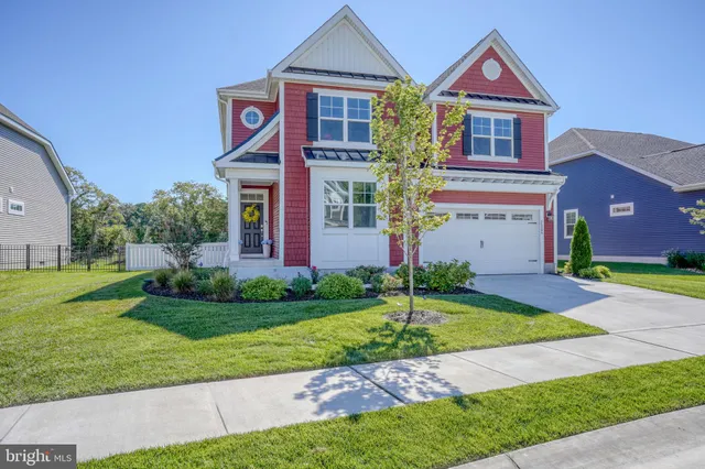 a living room with furniture and windows