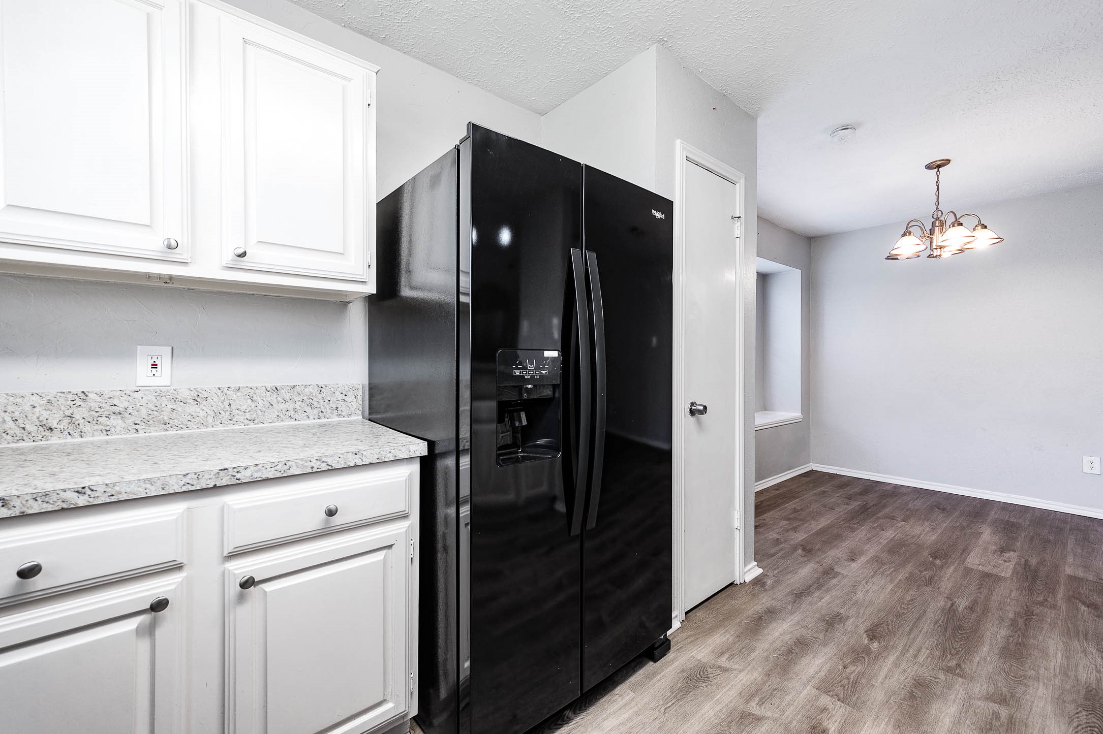 21402 Golden Dove Drive Spring, TX 77388 - Photo 15 of 29 a kitchen with granite countertop a refrigerator and a stove top oven