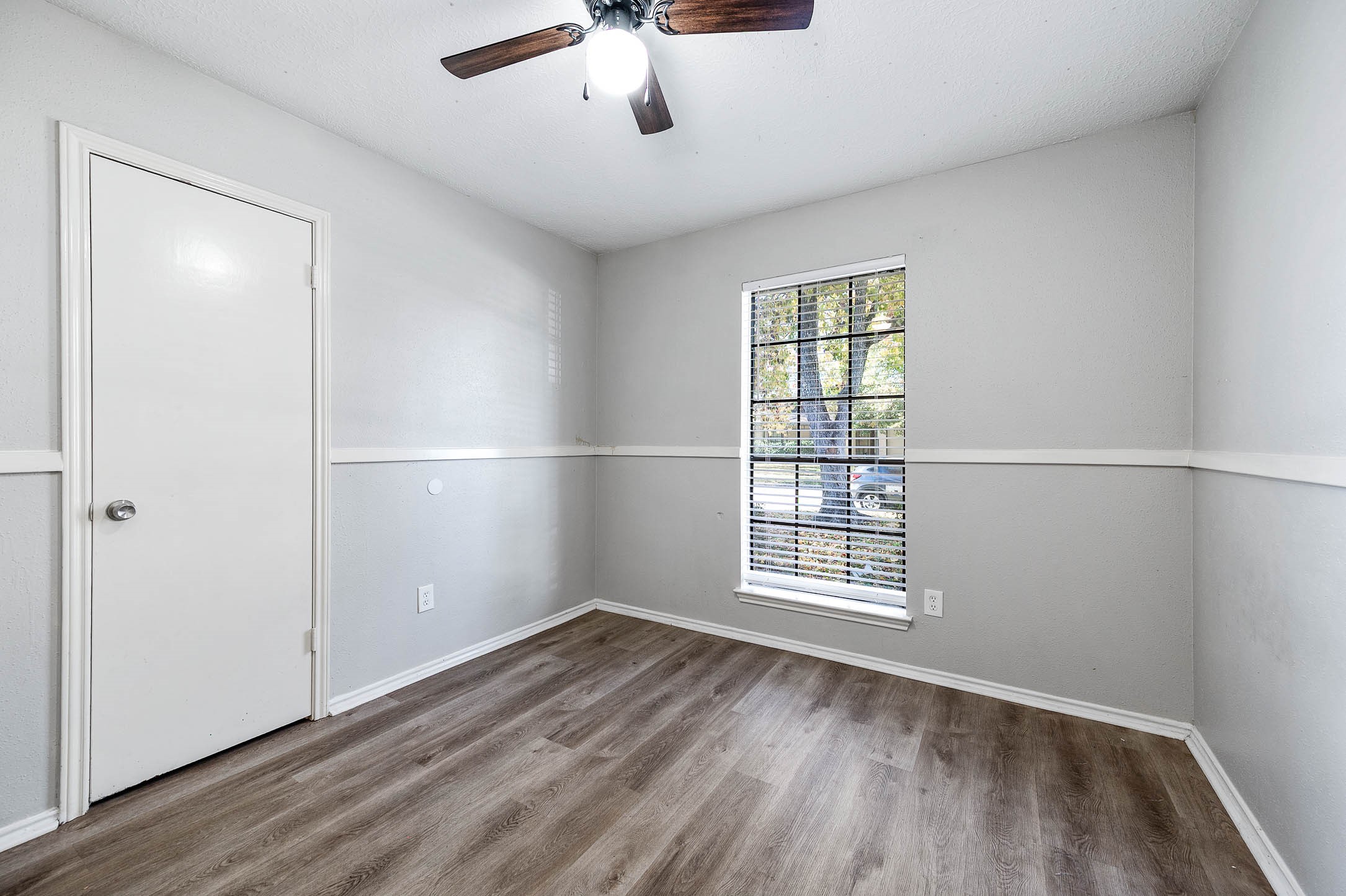 21402 Golden Dove Drive Spring, TX 77388 - Photo 18 of 29 a view of an empty room with wooden floor and a window
