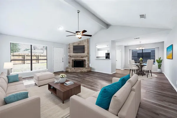 a living room with furniture and a fireplace