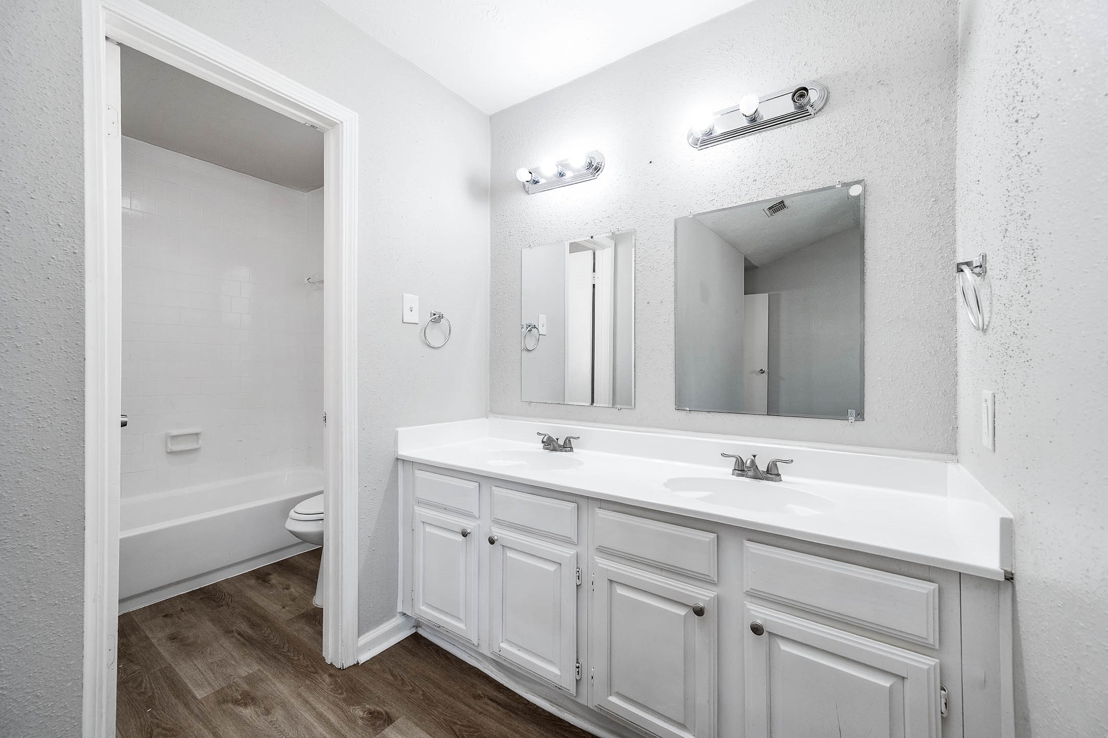 21402 Golden Dove Drive Spring, TX 77388 - Photo 23 of 29 a bathroom with a sink double vanity granite tub and a mirror