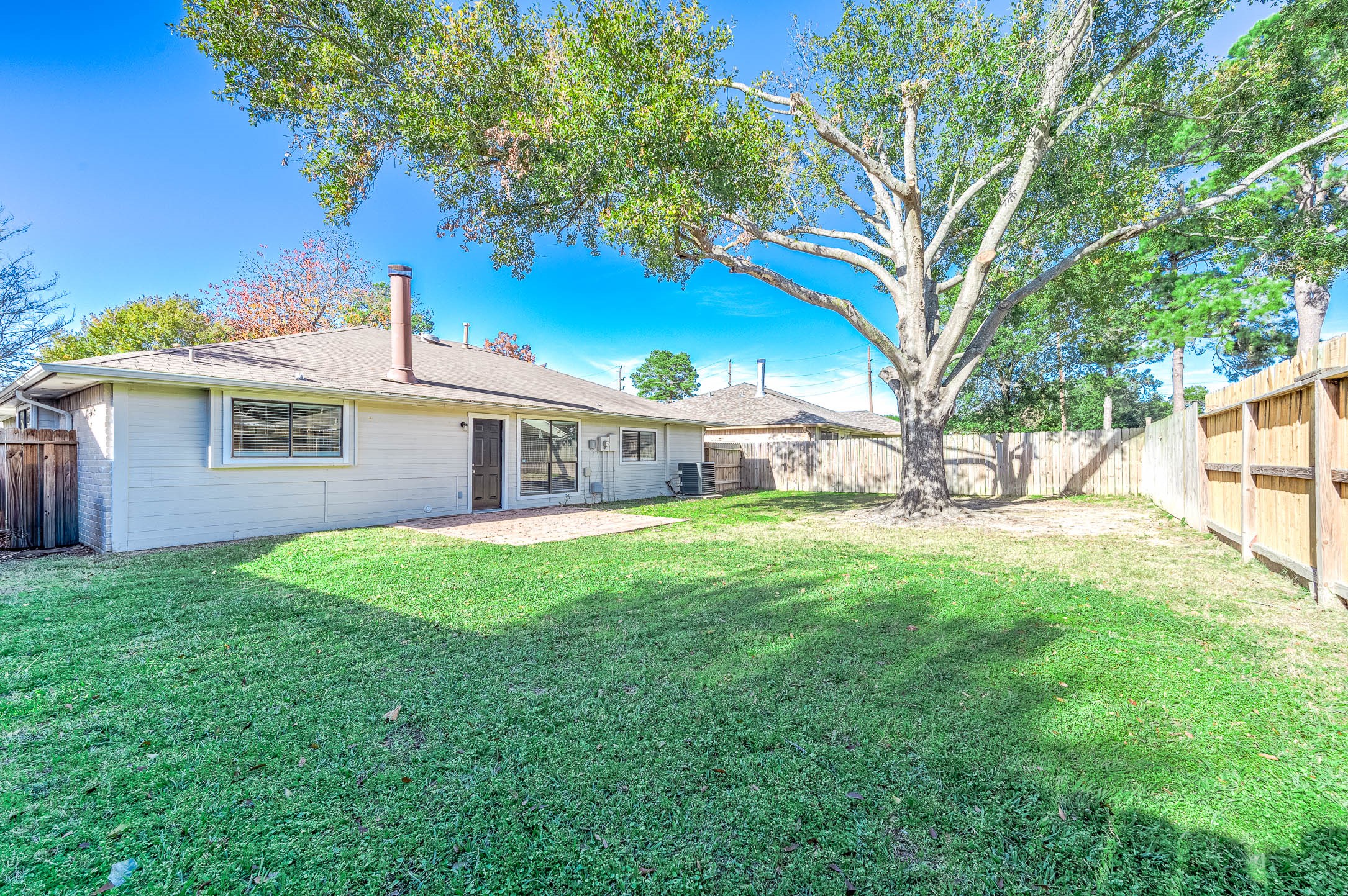 21402 Golden Dove Drive Spring, TX 77388 - Photo 27 of 29 a view of a yard with a house and a large tree