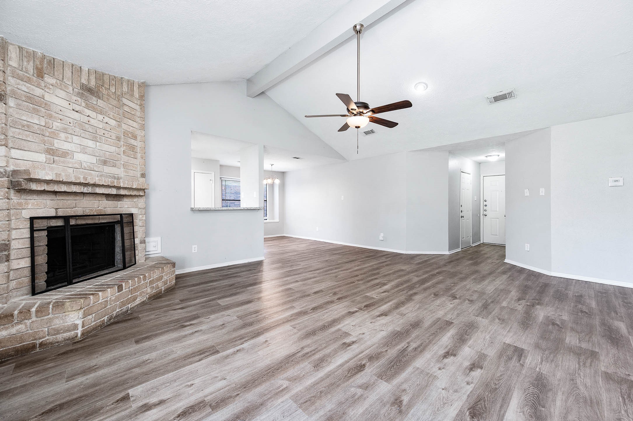 21402 Golden Dove Drive Spring, TX 77388 - Photo 10 of 29 a view of an empty room with wooden floor fireplace and a window