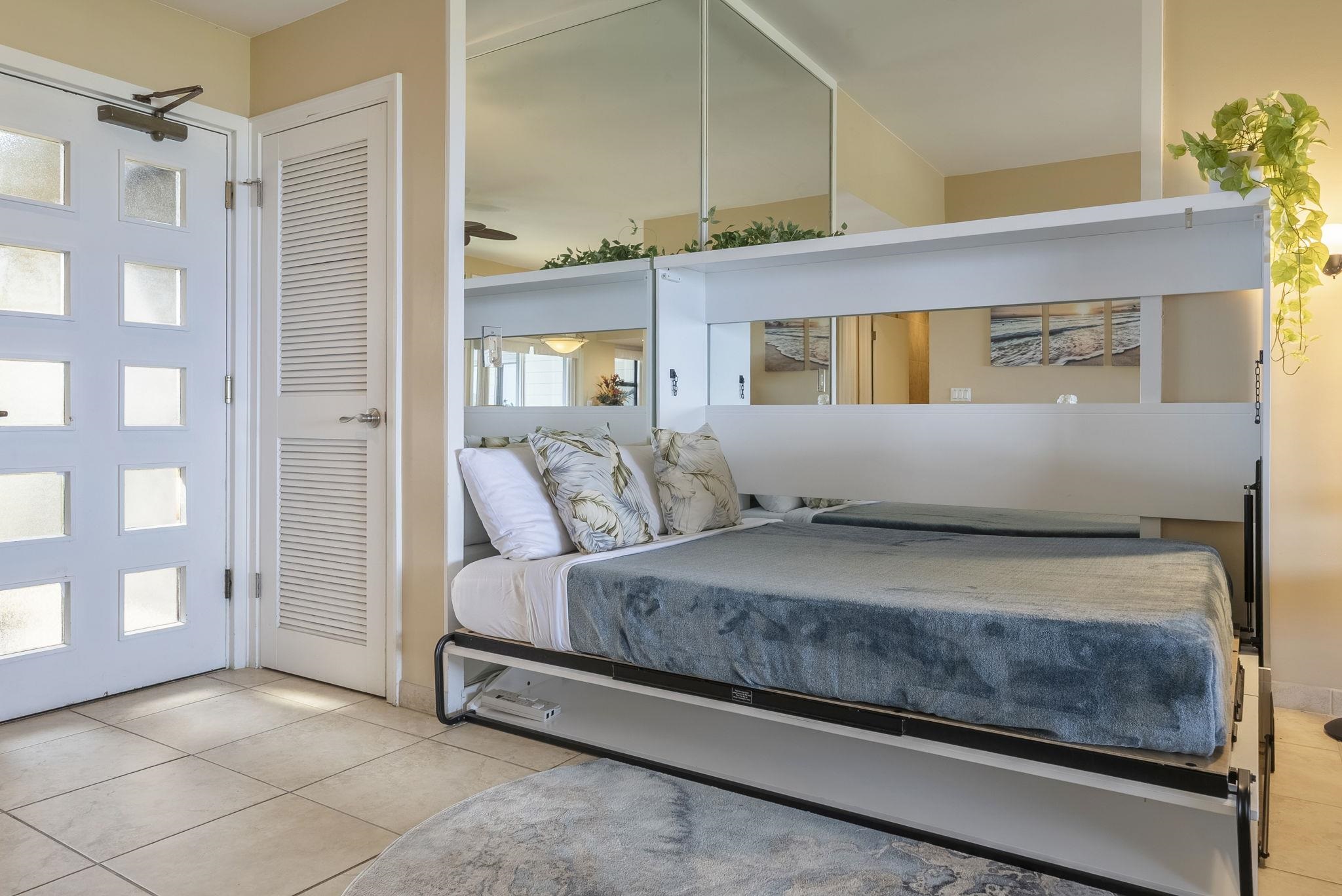 100 Ridge Road, Unit 2721 Lahaina, HI 96761 - Photo 8 of 16 a bedroom with a bed and a potted plant on the dresser