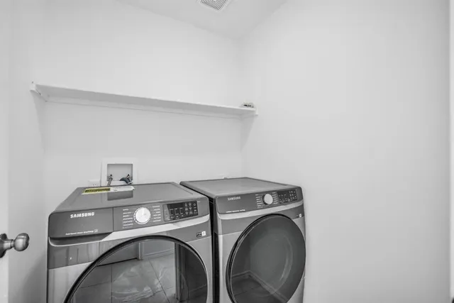 a view of hallway with wooden floor