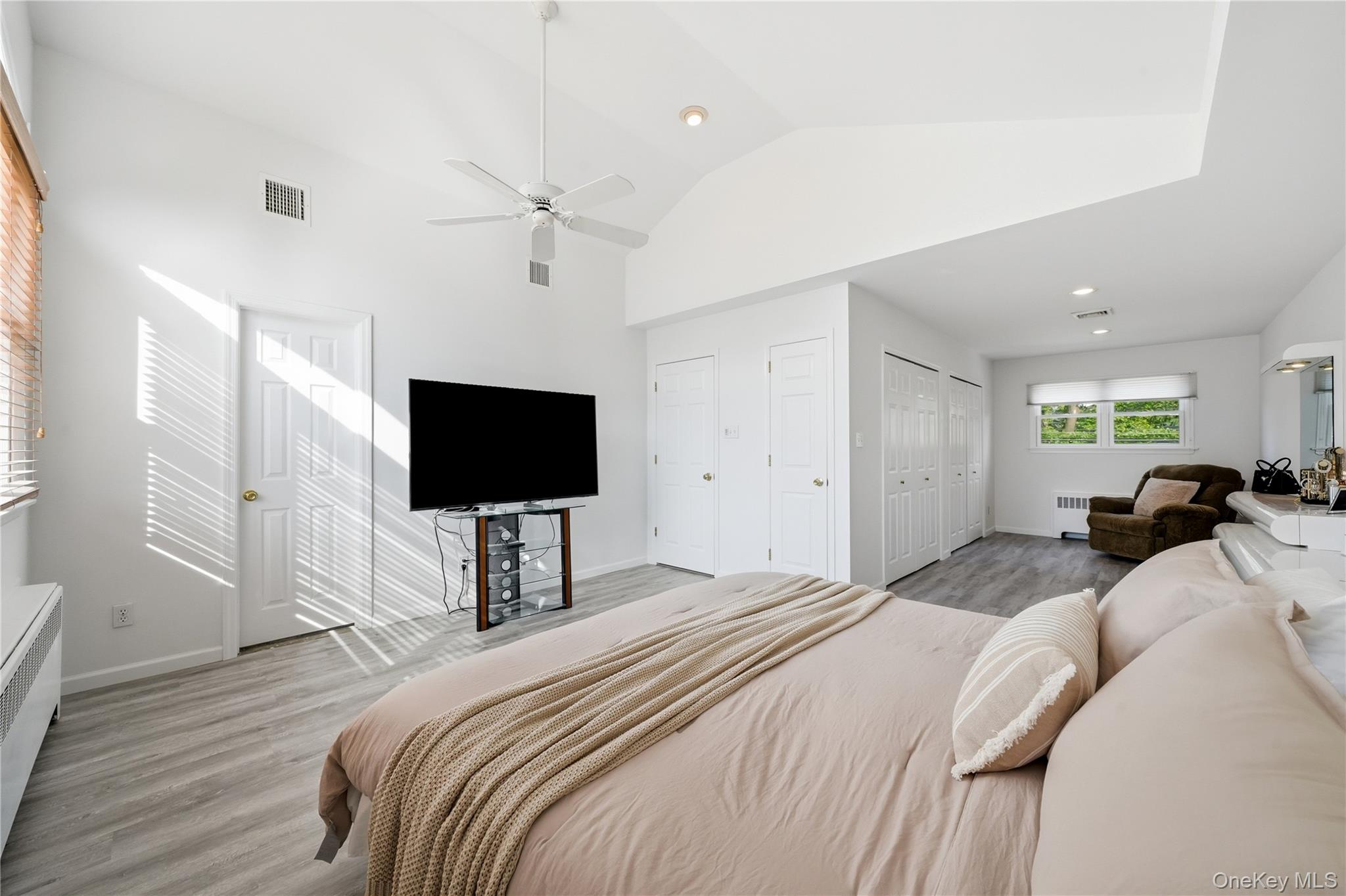 1853 Decatur Avenue Merrick, NY 11566 - Photo 24 of 43 a bedroom with a bed and a flat screen tv