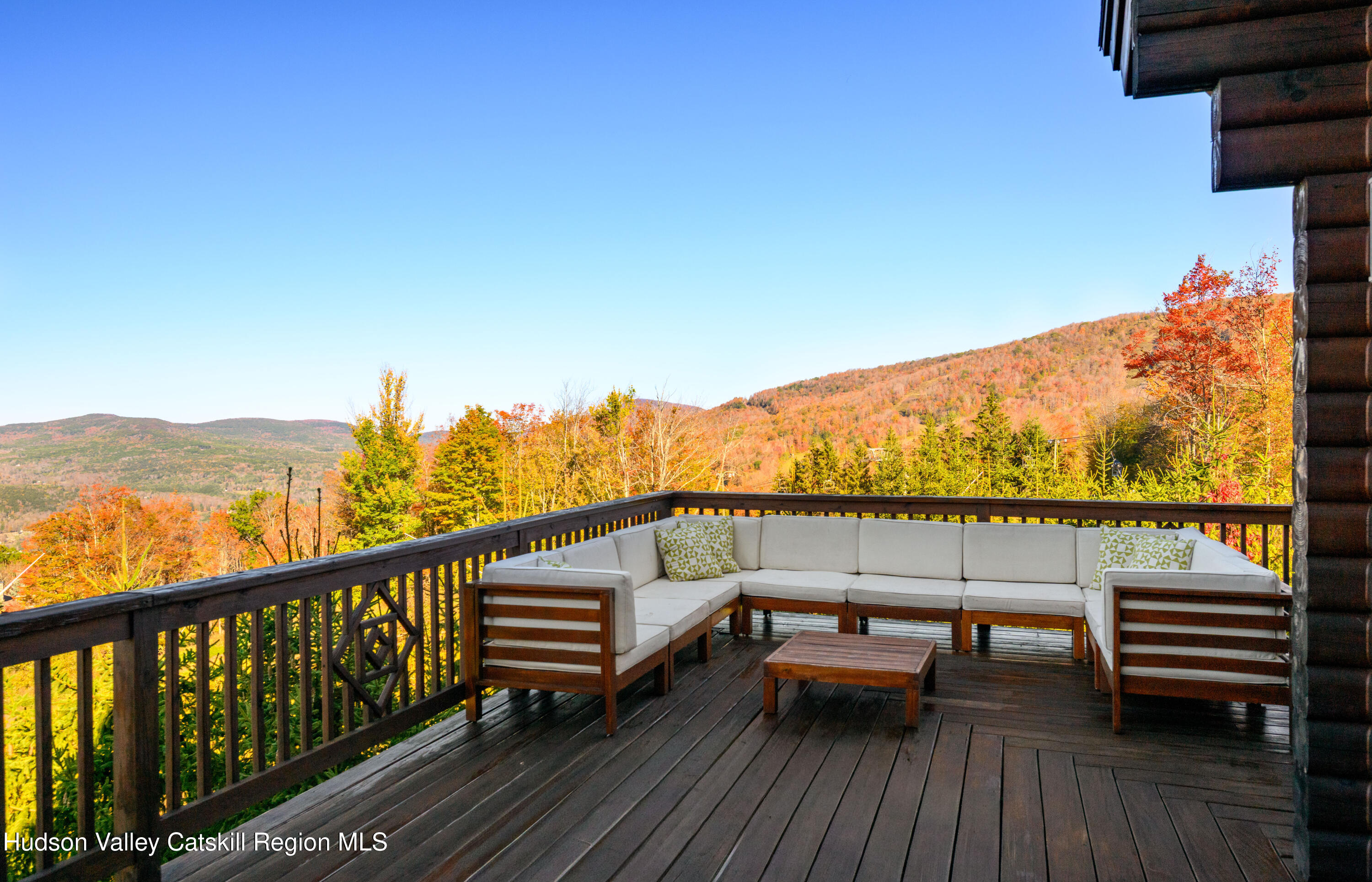 209 Club Road Windham, NY 12496 - Photo 14 of 18 a view of a balcony with chairs and wooden floor