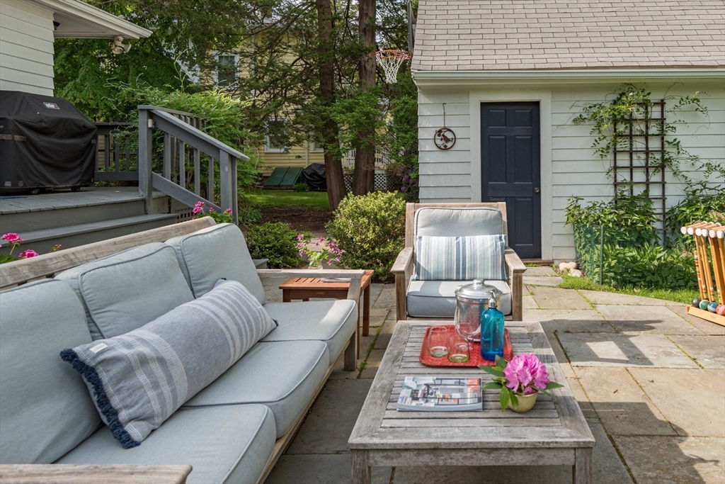 40 Stone Road Belmont, MA 02478 - Photo 41 of 42 a balcony with furniture and potted plants
