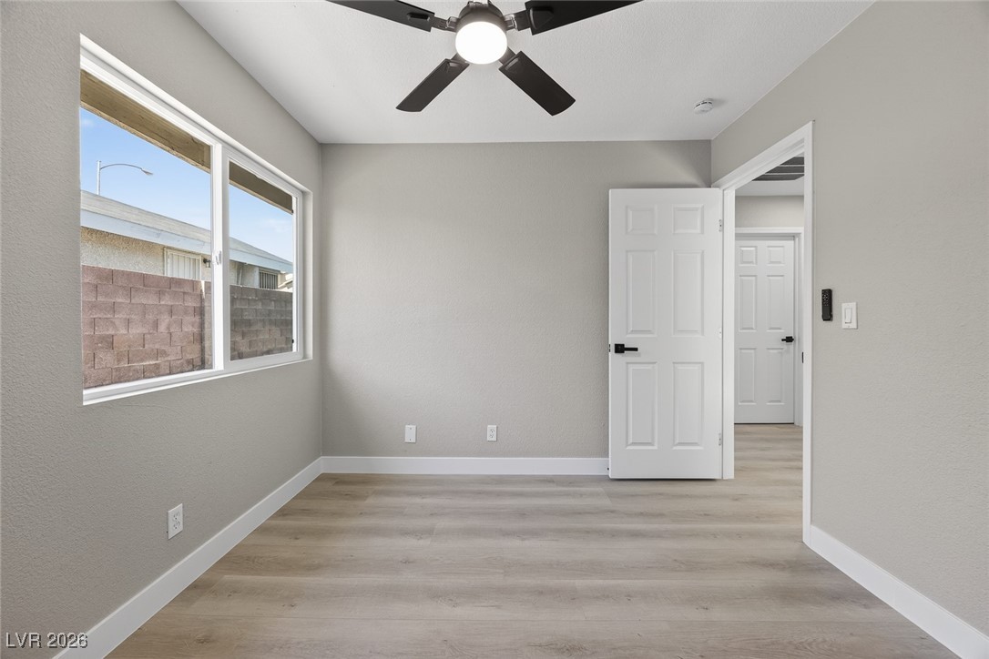 7071 Wedgewood Way Las Vegas, NV 89147 - Photo 19 of 37 Spare room with light wood-type flooring and a ceiling fan