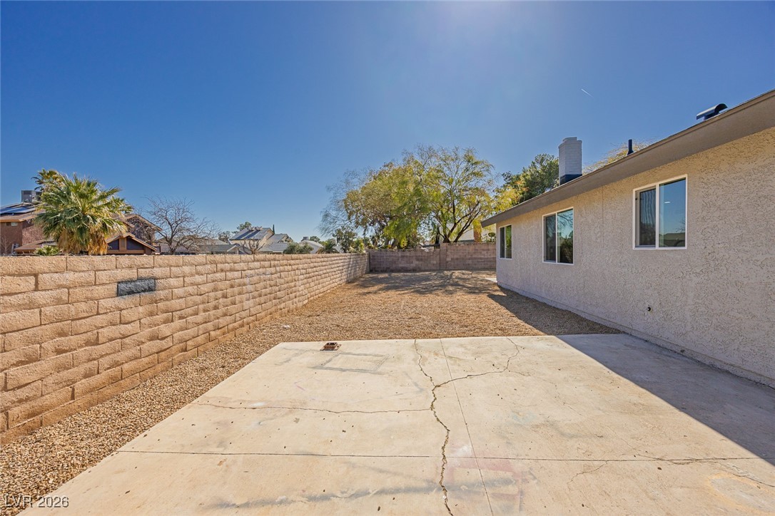 7071 Wedgewood Way Las Vegas, NV 89147 - Photo 31 of 37 Fenced backyard with a patio