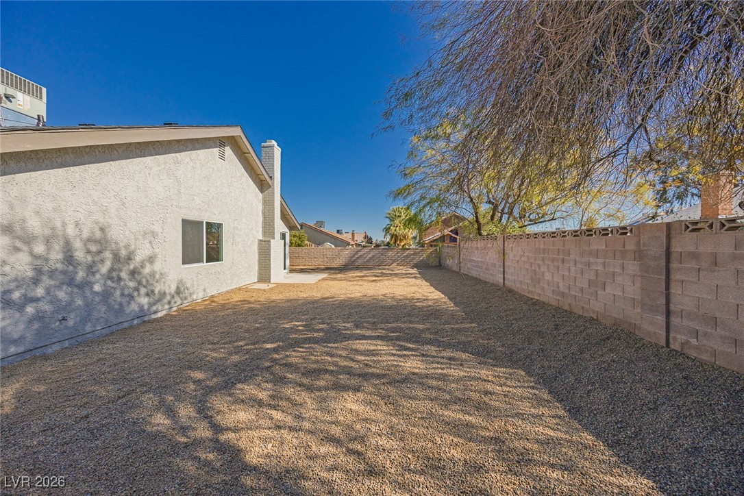 7071 Wedgewood Way Las Vegas, NV 89147 - Photo 34 of 37 View of fenced backyard