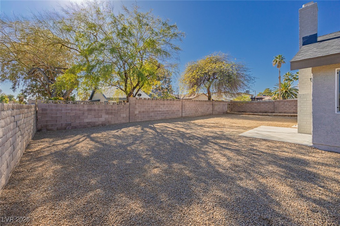 7071 Wedgewood Way Las Vegas, NV 89147 - Photo 35 of 37 View of fenced backyard