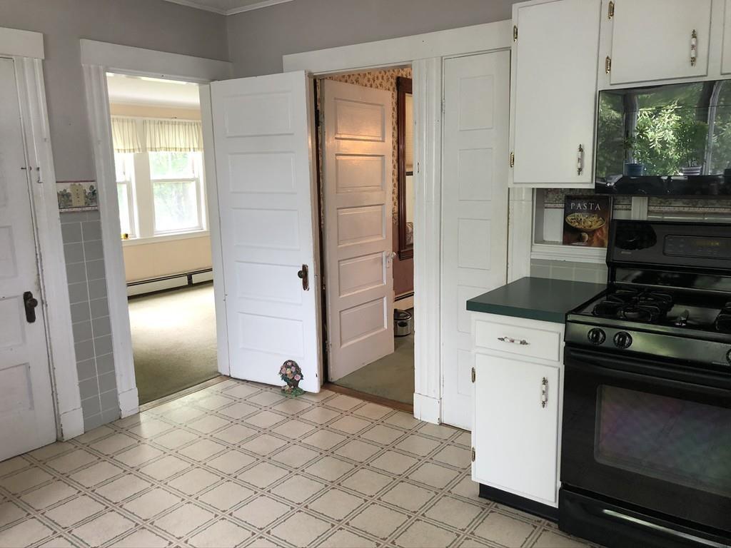 35 Adams Street Norwood, MA 02062 - Photo 12 of 40 a kitchen with stainless steel appliances granite countertop a stove and a refrigerator