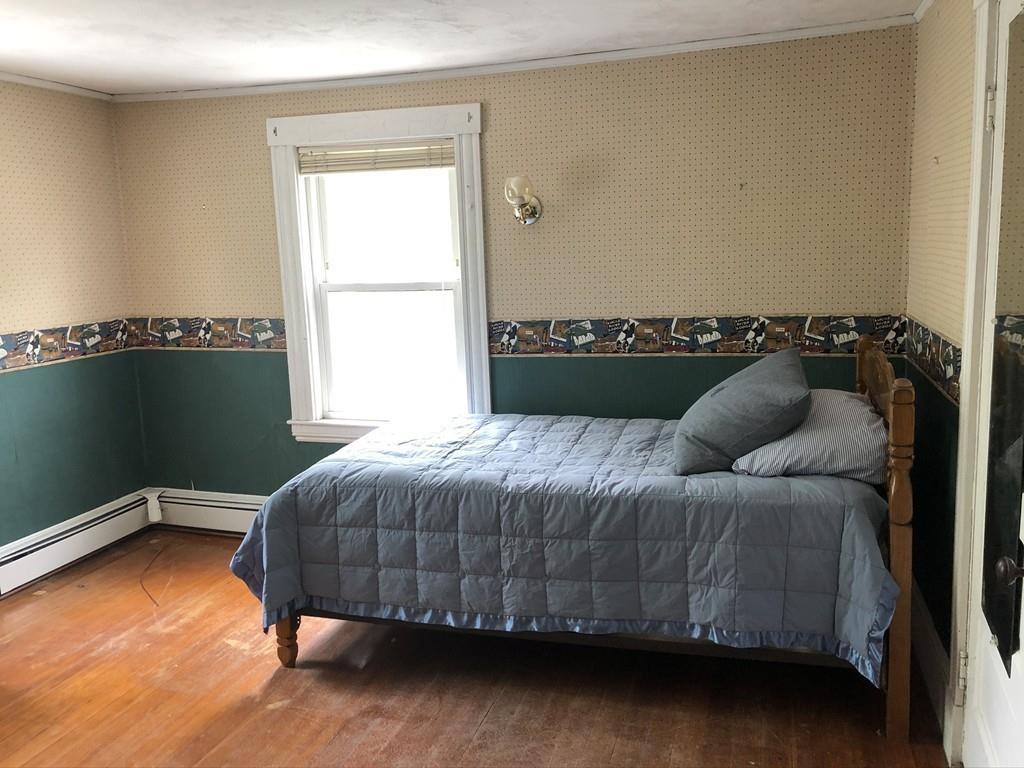 35 Adams Street Norwood, MA 02062 - Photo 27 of 40 a bedroom with a bed and window