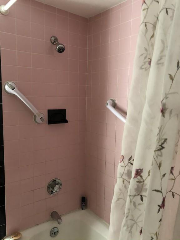 35 Adams Street Norwood, MA 02062 - Photo 30 of 40 a bathroom with a shower and a tub