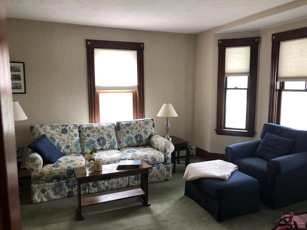 35 Adams Street Norwood, MA 02062 - Photo 8 of 40 a living room with furniture and a window