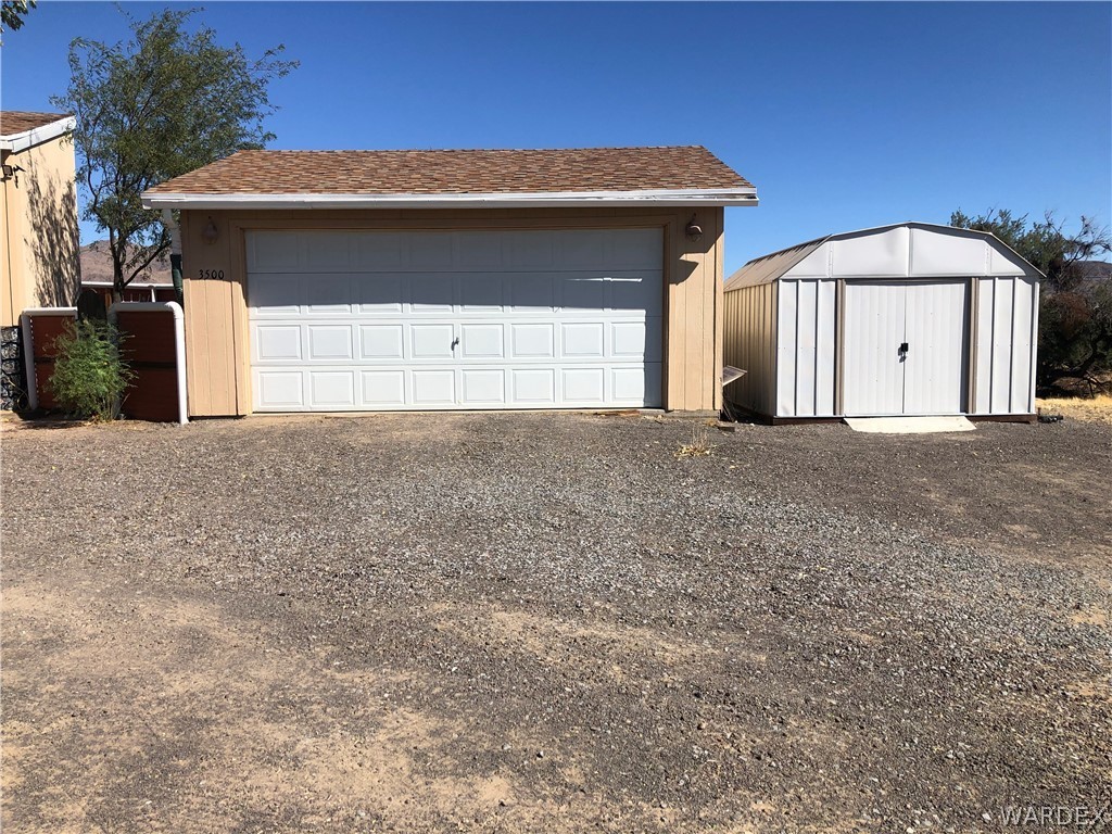 3500 Aztec Road Golden Valley, AZ 86413 - Photo 23 of 23 a front view of a house with a garage