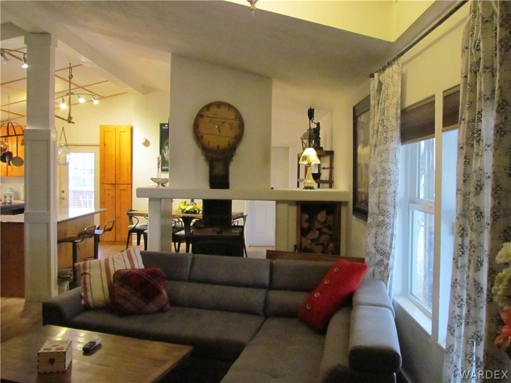 3500 Aztec Road Golden Valley, AZ 86413 - Photo 5 of 23 a living room with furniture and a fireplace