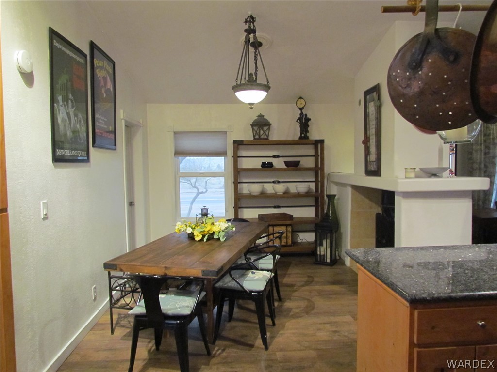 3500 Aztec Road Golden Valley, AZ 86413 - Photo 7 of 23 a kitchen with a table and chairs in it