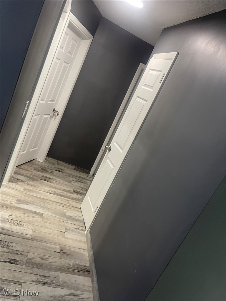 603 Liberty Road Youngstown, OH 44505 - Photo 12 of 42 Corridor with light wood finished floors