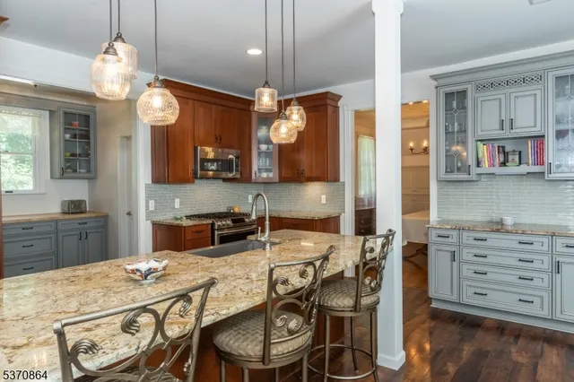 a kitchen with a table and chairs in it