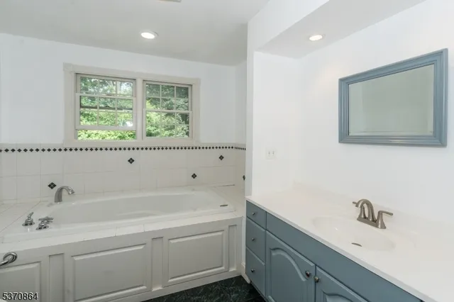 a bathroom with a sink and a bathtub