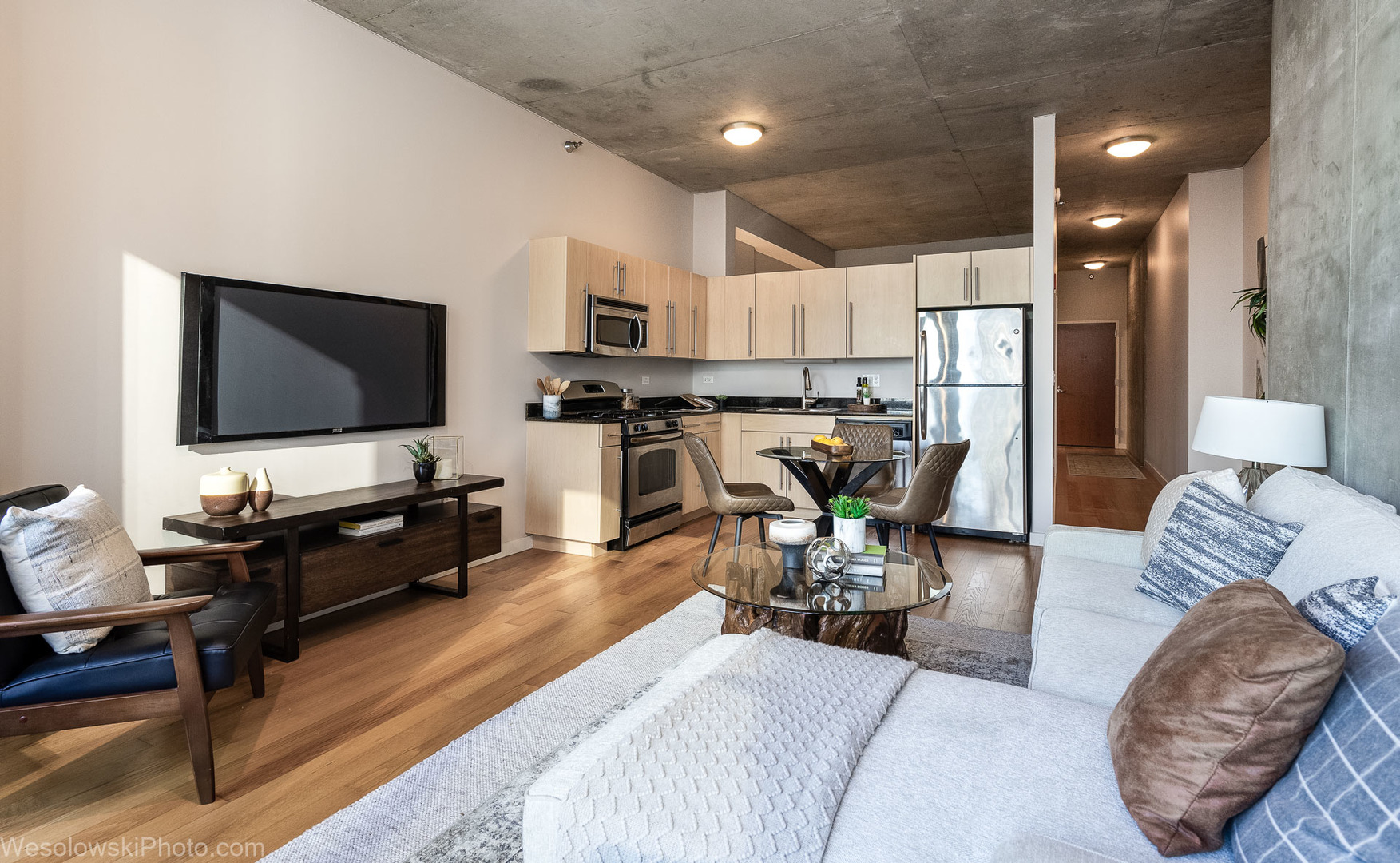 235 West Van Buren Street, Unit 2417 Chicago, IL 60607 - Photo 3 of 22 a living room with furniture and a flat screen tv