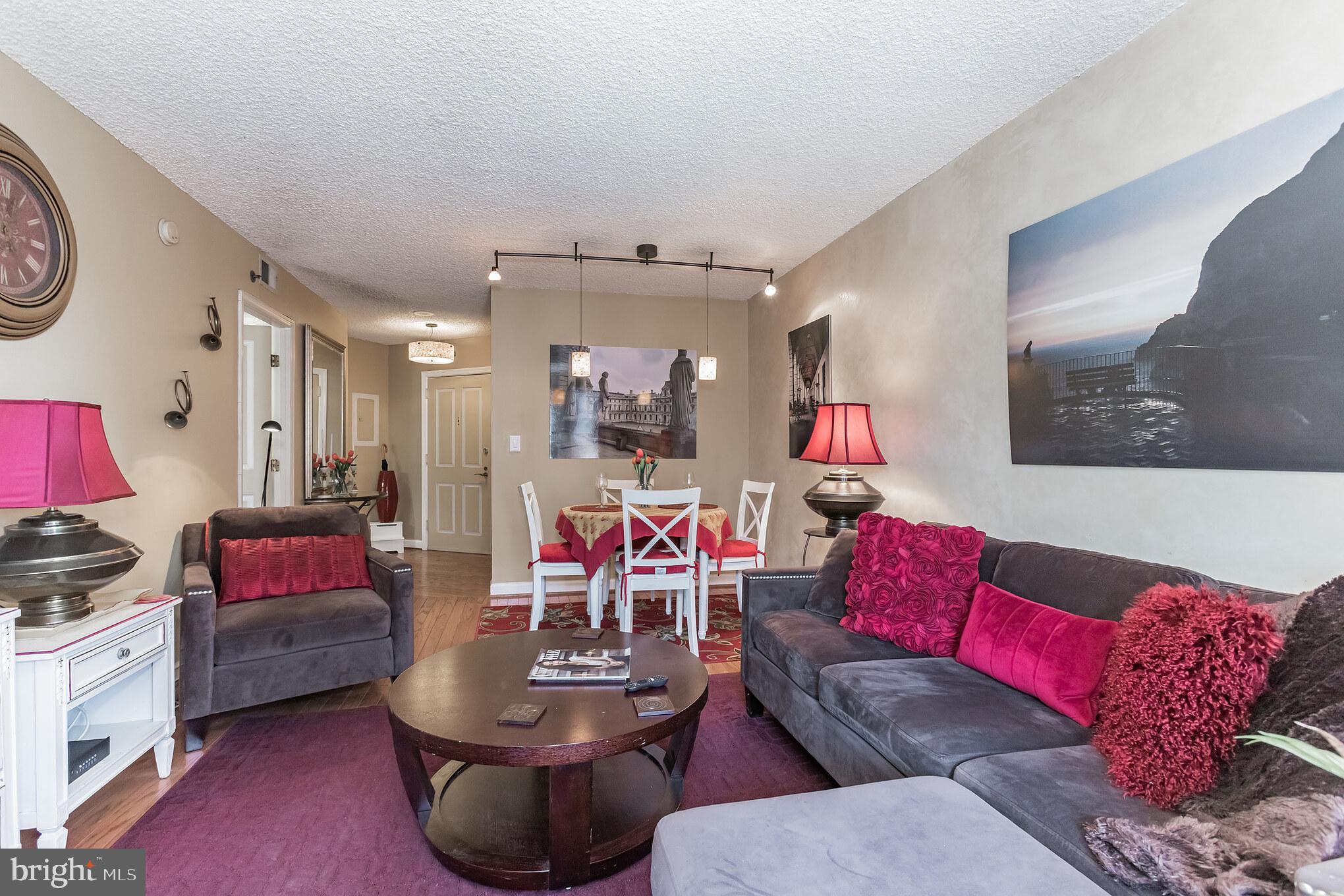 601 Pennsylvania Avenue Northwest, Unit 705 Washington, DC 20004 - Photo 11 of 29 a living room with furniture and a wooden floor